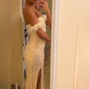 This is an off white strapless sequin dress.